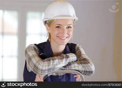 young woman with safety helmet looking at the camera