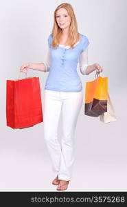 young woman with shopping bags