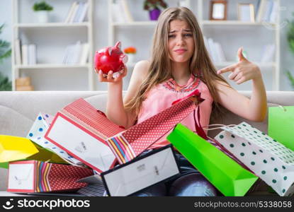 Young woman with shopping bags indoors home on sofa