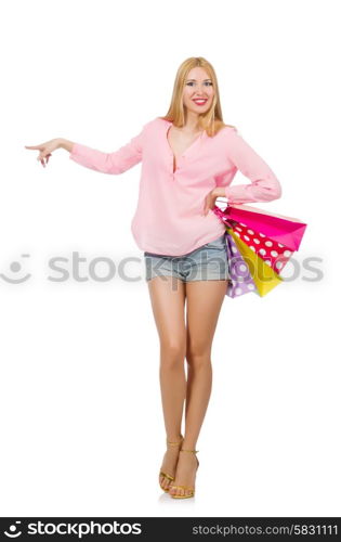 Young woman with shopping bags on white