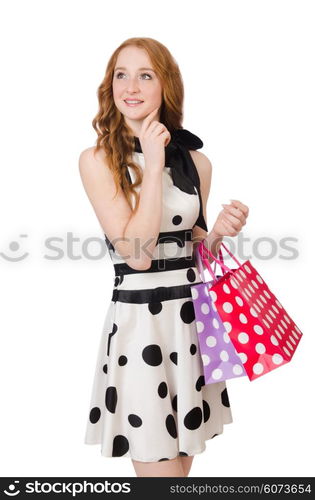 Young woman with shopping bags on white