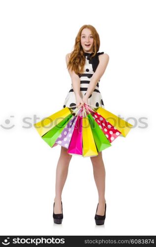 Young woman with shopping bags on white