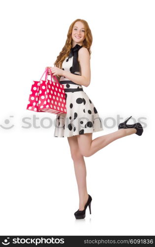 Young woman with shopping bags on white