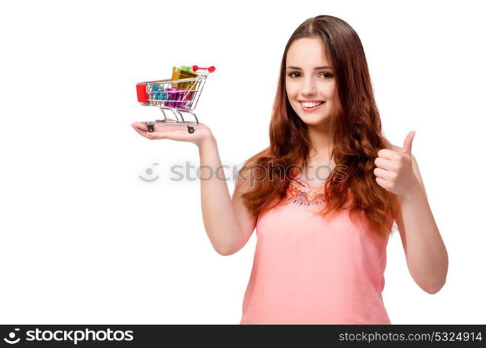 Young woman with shopping cart isolated on white