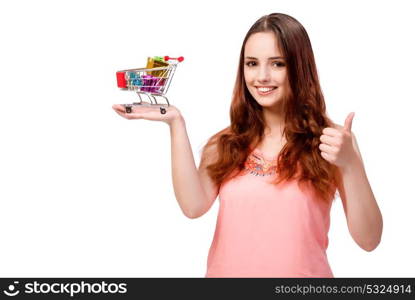 Young woman with shopping cart isolated on white