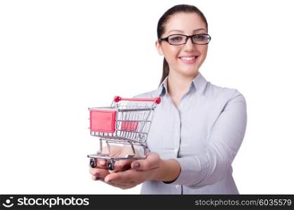 Young woman with shopping cart on white