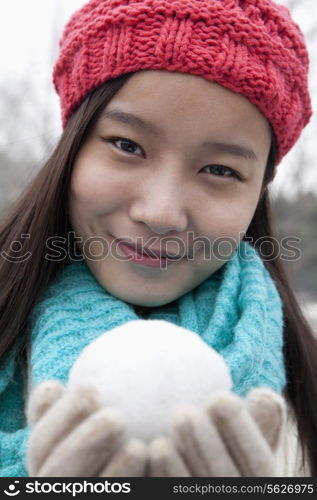 Young Woman with Snowball