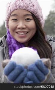 Young Woman with Snowball