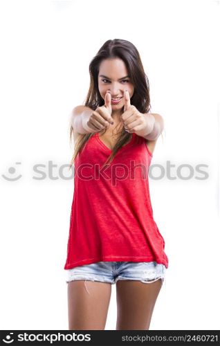 Young woman with thumbs up, isolated over a white background