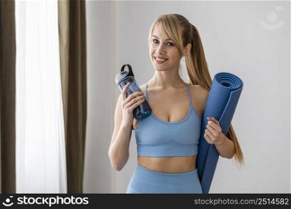 young woman with water bottle mat