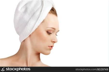 Young woman with white towel on her head with closed eyes