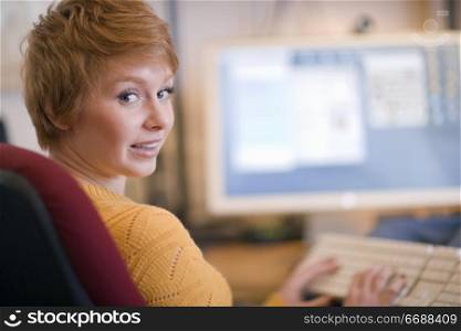 Young woman working at a computer
