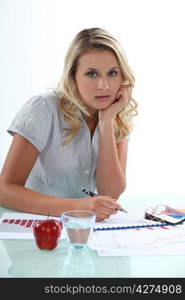 Young woman working at her desk