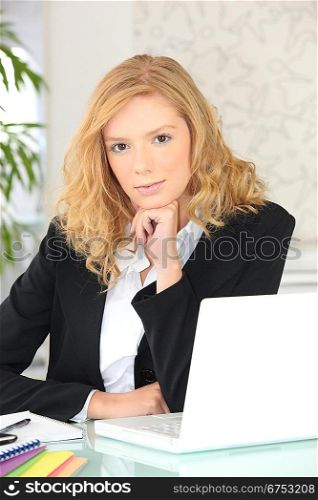 Young woman working at her laptop
