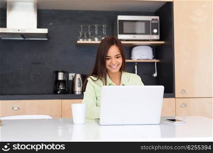 Young woman working at home in the morning