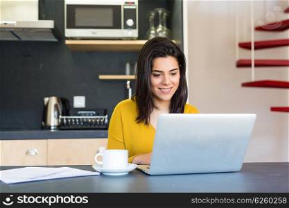 Young woman working at home in the morning