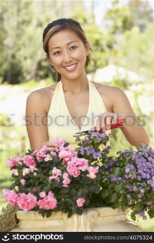 Young Woman Working In Garden