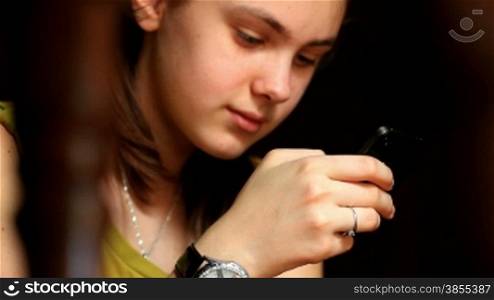 Young woman working on a mobile device