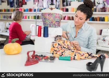 young woman working sewing machine
