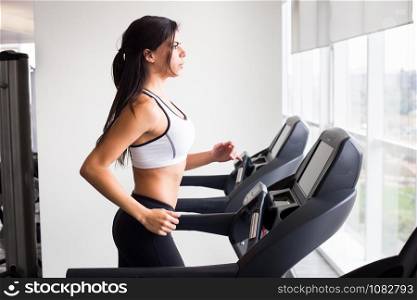 Young woman workout in gym treadmill healthy lifestyle