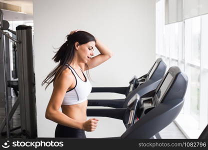Young woman workout in gym treadmill healthy lifestyle