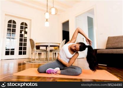 Young woman workout in the room at home
