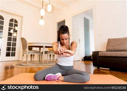 Young woman workout in the room at home