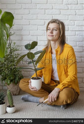 young woman yellow shirt gardening