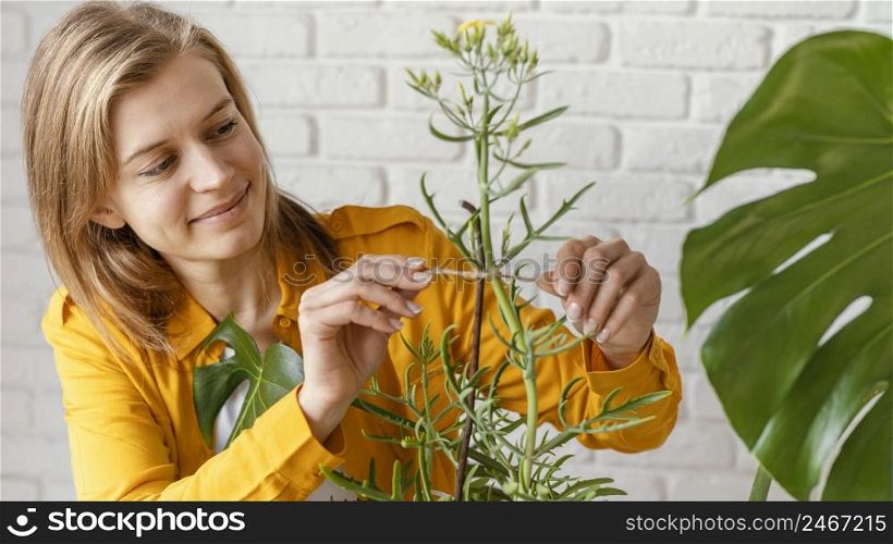 young woman yellow shirt gardening home 3