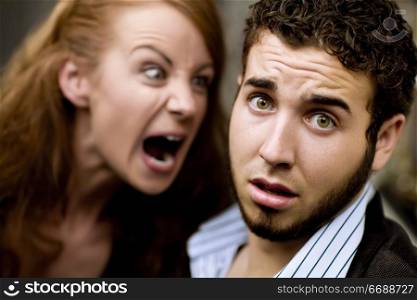 Young woman yells at man with beard