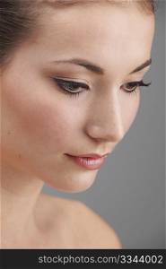 Young womans face with subtle make up and eye lash extensions