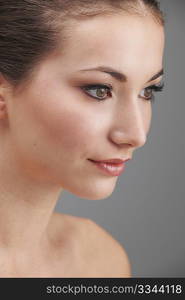 Young womans face with subtle make up and eye lash extensions