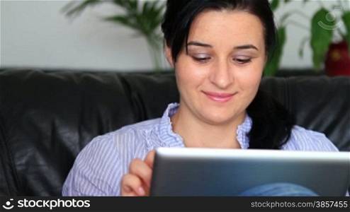 Young women at home using a tablet computer