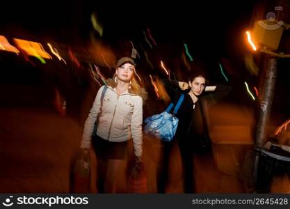 Young women carrying shopping bags