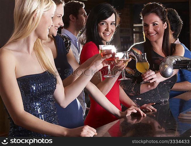 Young women drinking at bar