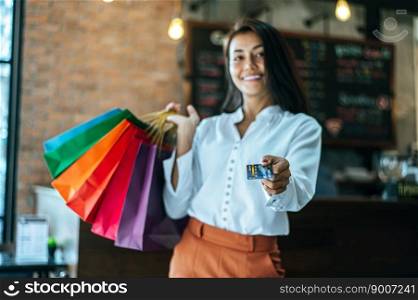  Young women enjoy shopping with credit cards.