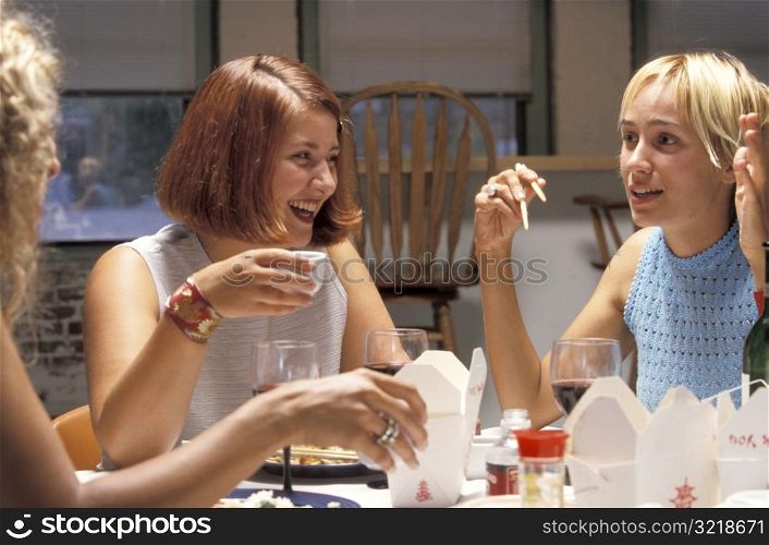 Young Women Having Dinner Party