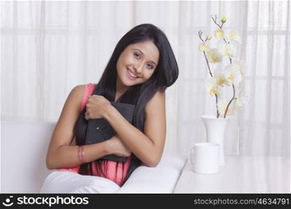Young WOMEN hugging a photo frame