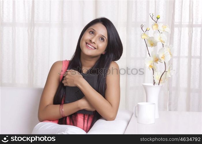 Young WOMEN hugging a photo frame