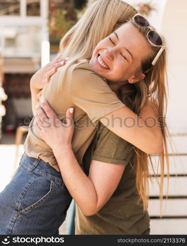 young women hugging each other