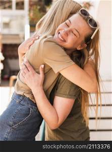 young women hugging each other