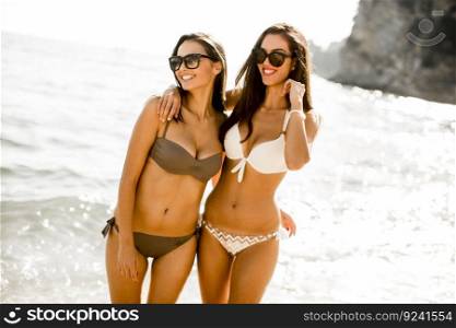 Young women in a bikini having fun at the beach