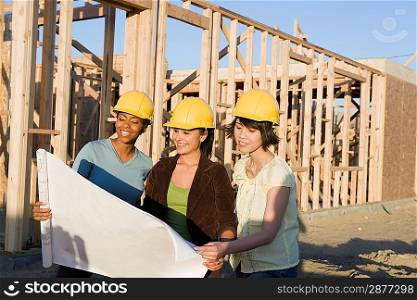 Young women in construction site