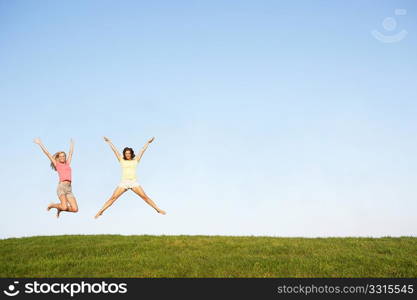 Young women jumping in air