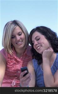 Young Women Looking at a Cell Phone