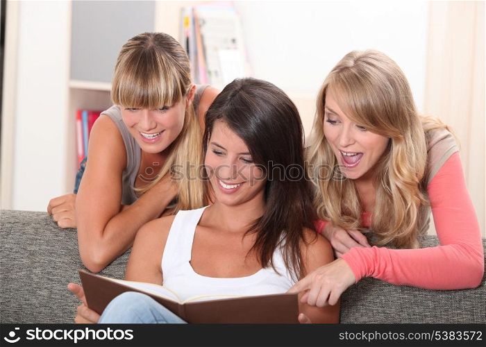 Young women looking at photos