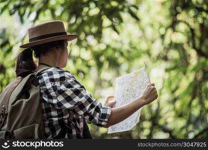 young women people Hiking with friends backpacks walking together and looking map and taking photo camera by the road and looking happy ,Relax time on holiday concept travel