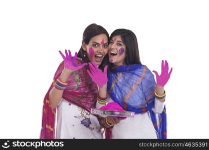 Young women playing holi