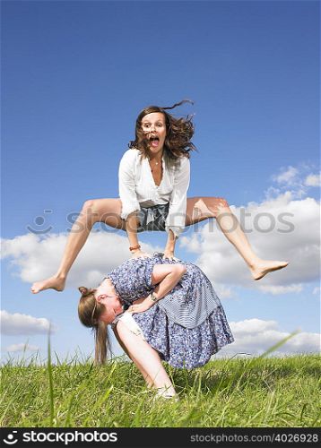 young women playing leapfrog