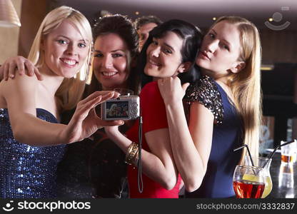 Young women posing at party